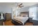 Comfortable main bedroom with hardwood floors and ensuite bathroom access at 5063 Carillon Ln, Windermere, FL 34786
