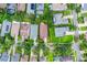 Aerial view of a home with a large backyard surrounded by mature trees in a residential neighborhood at 5063 Carillon Ln, Windermere, FL 34786