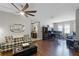 Comfortable living room featuring hardwood floors and easy access to the workspace at 5063 Carillon Ln, Windermere, FL 34786