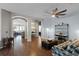 Inviting living room with a cozy atmosphere, hardwood floors and archways to other rooms at 5063 Carillon Ln, Windermere, FL 34786