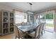 Bright dining room features a large window and sliding glass door providing lots of natural light at 5063 Carillon Ln, Windermere, FL 34786