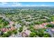 Extensive aerial shot capturing a large residential area with green trees and lush landscaping, embodying community living at 5063 Carillon Ln, Windermere, FL 34786