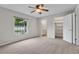 Bedroom with natural light, a view of the pool, and an entrance to the bathroom and closet at 5089 Jennifer Pl, Orlando, FL 32807