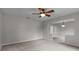 Inviting living area offering ample space, neutral carpet and natural lighting from the exterior windows at 5089 Jennifer Pl, Orlando, FL 32807