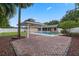 Backyard oasis featuring a refreshing swimming pool, a covered gazebo, and a spacious brick patio for outdoor fun at 5089 Jennifer Pl, Orlando, FL 32807