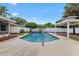 Backyard pool featuring a white fence, a gazebo and tasteful landscaping at 5089 Jennifer Pl, Orlando, FL 32807