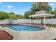 Refreshing pool with gazebo, surrounded by lush landscaping and a privacy fence, creating a serene backyard oasis at 5089 Jennifer Pl, Orlando, FL 32807