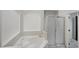 A bathroom is shown with a bathtub, shower, and white walls at 5231 Alavista Dr, Orlando, FL 32837
