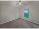 Bright bedroom with carpet, a ceiling fan, and a large window at 5231 Alavista Dr, Orlando, FL 32837