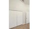 A carpeted bedroom with white walls features a closet with double doors at 5231 Alavista Dr, Orlando, FL 32837