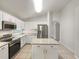 Modern kitchen features an island, stainless steel appliances, granite countertops and plenty of cabinet space at 5231 Alavista Dr, Orlando, FL 32837
