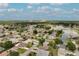 Features an aerial view of a home, a nearby lake, and residential area at 5517 W Sacramento Ct, Orlando, FL 32821
