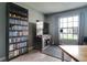 Bedroom with hardwood floors, a large window, and entertainment center at 5517 W Sacramento Ct, Orlando, FL 32821
