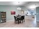 Inviting dining area with modern lighting, and easy access to the kitchen at 5517 W Sacramento Ct, Orlando, FL 32821