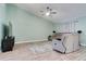 Bright living room with wood floors, light walls, and cozy seating arrangement at 5517 W Sacramento Ct, Orlando, FL 32821