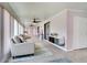 Inviting living room featuring neutral tones, a comfortable sofa, and plenty of natural light at 5517 W Sacramento Ct, Orlando, FL 32821
