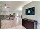 Spacious living room features tile and wood flooring, comfortable seating, and modern decor at 5517 W Sacramento Ct, Orlando, FL 32821