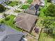Aerial view of a home with a fenced yard and lush landscaping at 610 Strihal Loop, Oakland, FL 34787