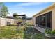 Fenced backyard with play equipment at 610 Strihal Loop, Oakland, FL 34787