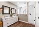 Modern bathroom features a double vanity and a glass-enclosed shower at 610 Strihal Loop, Oakland, FL 34787