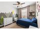 Charming bedroom features a mountain theme, dresser, and a comfortable bed at 610 Strihal Loop, Oakland, FL 34787