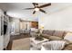 Open-concept living room seamlessly connects to the dining and kitchen areas at 610 Strihal Loop, Oakland, FL 34787