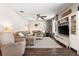Inviting living room features neutral tones, plush seating, and stylish decor at 610 Strihal Loop, Oakland, FL 34787