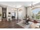 Spacious living room with beautiful hardwood floors and ample natural light at 610 Strihal Loop, Oakland, FL 34787