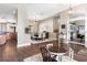 An open-concept living space with dining area, office and kitchen views at 610 Strihal Loop, Oakland, FL 34787