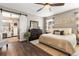 Spacious main bedroom offers a serene retreat with a large closet and natural light at 610 Strihal Loop, Oakland, FL 34787
