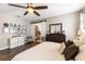 Inviting main bedroom showcases a walk-in closet and neutral decor at 610 Strihal Loop, Oakland, FL 34787