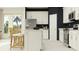 Modern kitchen boasting sleek white cabinets, stainless steel appliances, and an island for dining and meal preparation at 625 Terrapin Dr, Debary, FL 32713