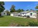 Backyard with grill, patio furniture and grassy area at 63 Madera Rd, Debary, FL 32713