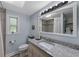 Updated bathroom featuring granite countertops, undermount sink, and tiled shower at 63 Madera Rd, Debary, FL 32713