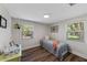 Bedroom featuring great natural light, wood floors, and modern ceiling fan at 63 Madera Rd, Debary, FL 32713