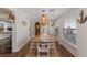 Dining room featuring a wood table and seating for six, with anchor decor and modern lighting at 63 Madera Rd, Debary, FL 32713