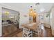 Dining room with a wooden table, seating for six and wicker pendant lighting at 63 Madera Rd, Debary, FL 32713