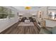 Living room featuring luxury vinyl plank flooring, neutral decor, and natural lighting at 63 Madera Rd, Debary, FL 32713