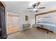Spacious main bedroom featuring wood beam detail, modern ceiling fan and lots of light at 63 Madera Rd, Debary, FL 32713