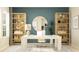 This home office offers a spacious desk, stylish decor, and plenty of natural light at 695 Peroni Ave, Debary, FL 32713