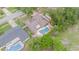 Aerial view shows the house, yard and pool at 7058 Archwood Dr, Orlando, FL 32819