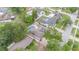Aerial view of the house showing the mature trees and residential neighborhood at 7058 Archwood Dr, Orlando, FL 32819
