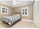 Bedroom with tile floors, two windows, and closet, providing a comfortable and inviting space at 7058 Archwood Dr, Orlando, FL 32819