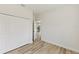 Bedroom with closet, hardwood flooring, and doorway to other parts of the home at 706 Marion Oaks Manor, Ocala, FL 34473
