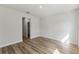 Neutral bedroom with wood-look floors, a walk-in closet, and plenty of natural light at 706 Marion Oaks Manor, Ocala, FL 34473