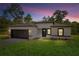 Charming home with a modern exterior, featuring a two-car garage and well-maintained landscaping at 706 Marion Oaks Manor, Ocala, FL 34473