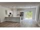 Modern kitchen featuring an island, stainless steel appliances, and pendant lighting over the countertop at 706 Marion Oaks Manor, Ocala, FL 34473