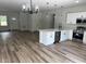 Open concept living space with modern kitchen and dining area bathed in natural light at 706 Marion Oaks Manor, Ocala, FL 34473