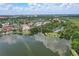 Beautiful aerial view of the community overlooking the lake and lush landscaping with city views at 720 Celebration Ave # 245, Kissimmee, FL 34747