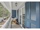 Charming balcony with blue shutters, wicker chair, and street views at 720 Celebration Ave # 245, Kissimmee, FL 34747